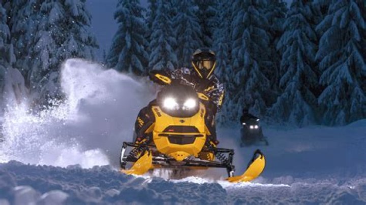 How do you climb a snowmobile hill?