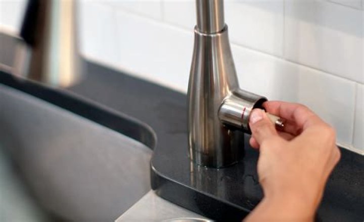How do you remove the handle on a Blanco kitchen faucet?