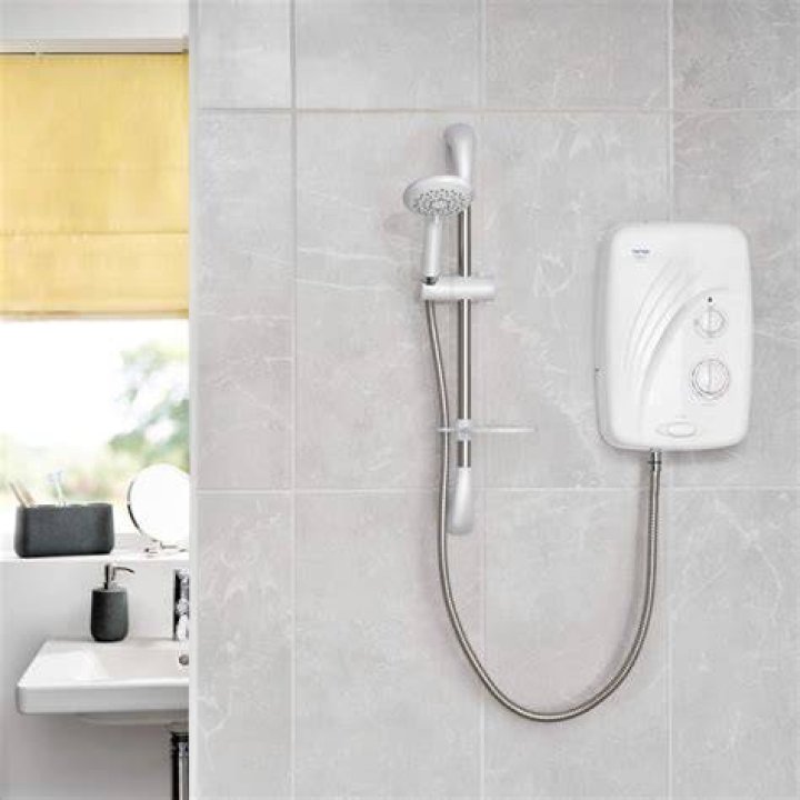 What are pumped electric showers?