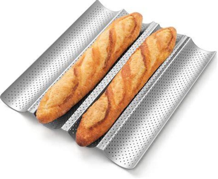 Why are baguette pans perforated?